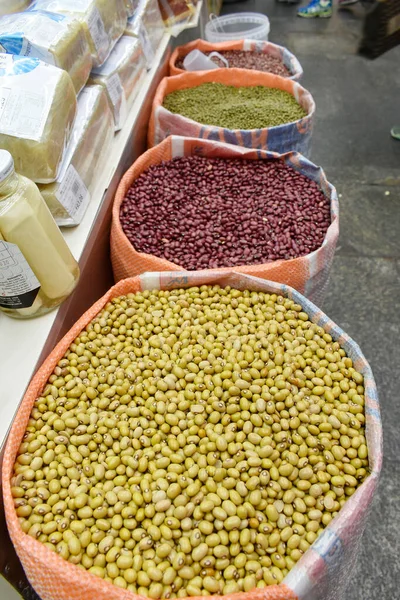 various kinds of beans in a wooden box