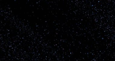 Siyah arkaplanda uçan toz parçacıkları