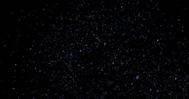 Siyah arkaplanda uçan toz parçacıkları