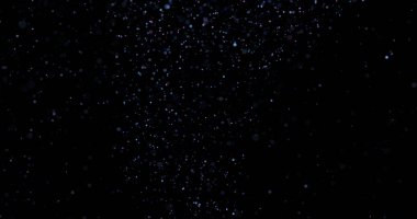 Siyah arkaplanda uçan toz parçacıkları
