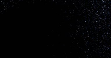 Siyah arkaplanda uçan toz parçacıkları