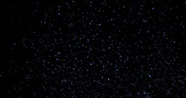 Siyah arkaplanda uçan toz parçacıkları