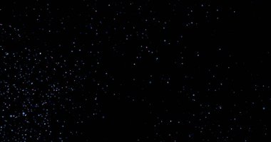 Siyah arkaplanda uçan toz parçacıkları