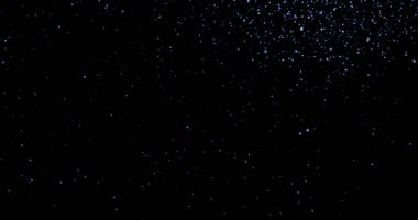 Siyah arkaplanda uçan toz parçacıkları