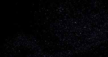 Siyah arkaplanda uçan toz parçacıkları