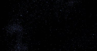 Siyah arkaplanda uçan toz parçacıkları