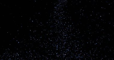 Siyah arkaplanda uçan toz parçacıkları