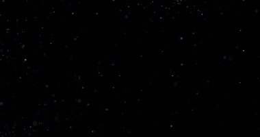 Siyah arkaplanda uçan toz parçacıkları