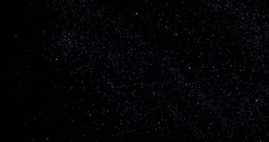 Siyah arkaplanda uçan toz parçacıkları