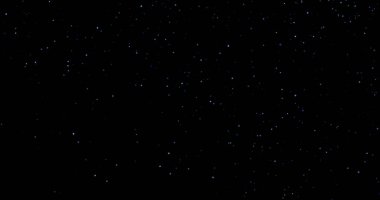 Siyah arkaplanda uçan toz parçacıkları