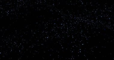 Siyah arkaplanda uçan toz parçacıkları