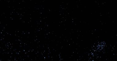 Siyah arkaplanda uçan toz parçacıkları