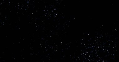 Siyah arkaplanda uçan toz parçacıkları