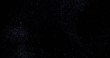 Siyah arkaplanda uçan toz parçacıkları