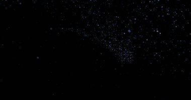 Siyah arkaplanda uçan toz parçacıkları