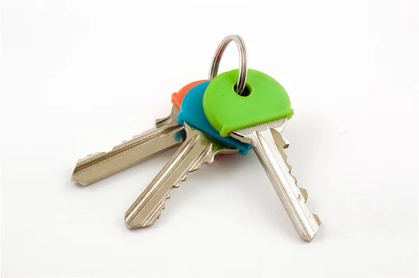 Üç evin anahtarları ile renkli — Stok fotoğraf