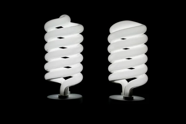 Deux ampoules spirales de faible énergie allumées — Photo