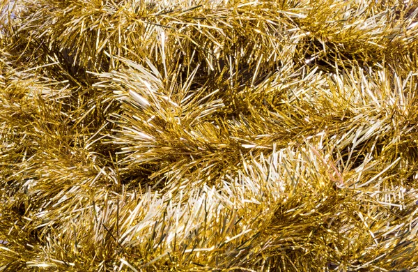 Gold tinsel — Stock fotografie