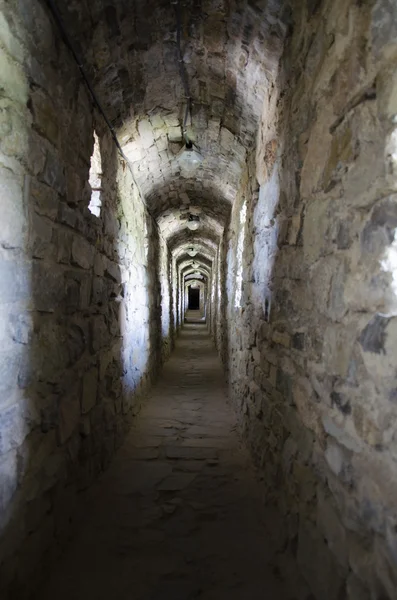 Tunnel in a medieval castle-fortress in Kamenetz-Podolsk. Ukraine — Stock Photo, Image