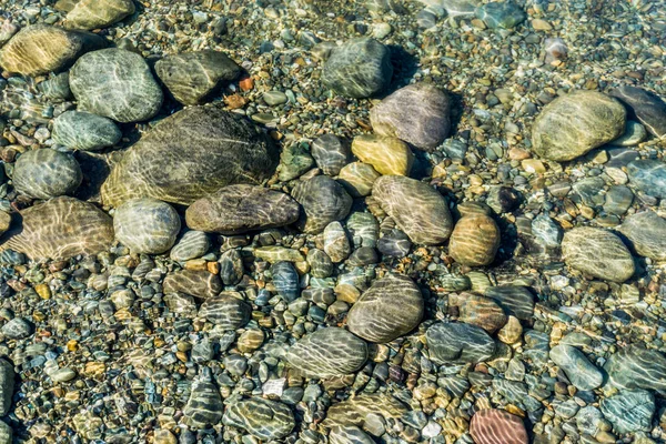 华盛顿州清澈水面下岩石的背景照片 — 图库照片