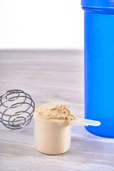 Vanilla Whey Protein Scoop Blue Milk Shaker White Marble Surface — Stock Photo, Image