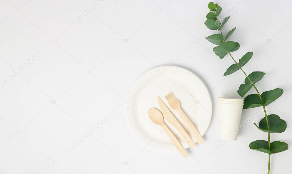 Zero waste concept, paper , wooden tableware, cups. White background. High quality photo