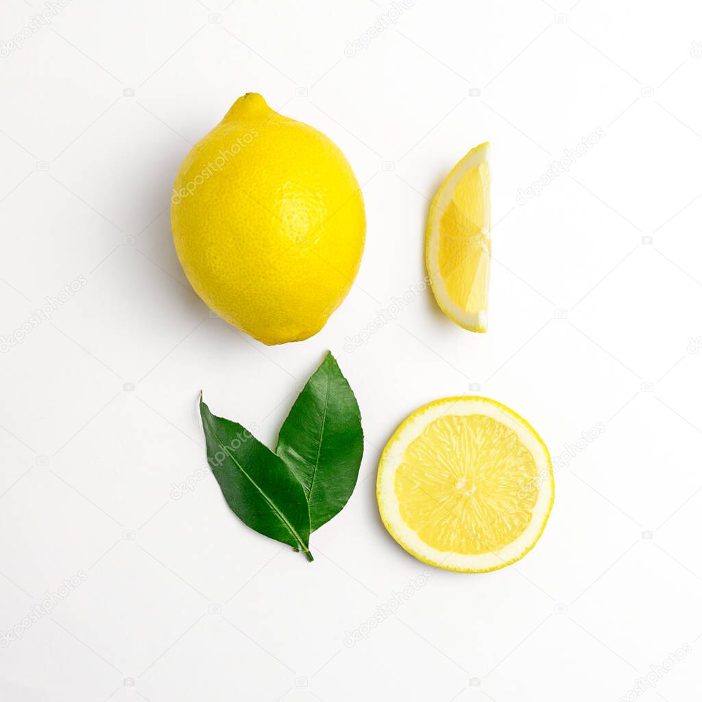 lemon and slices with leaves on white background. High quality photo