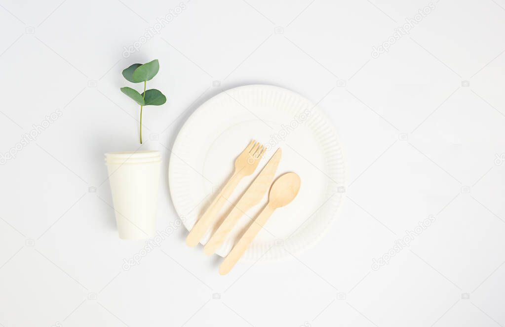 Zero waste concept, paper , wooden tableware, cups. White background. High quality photo