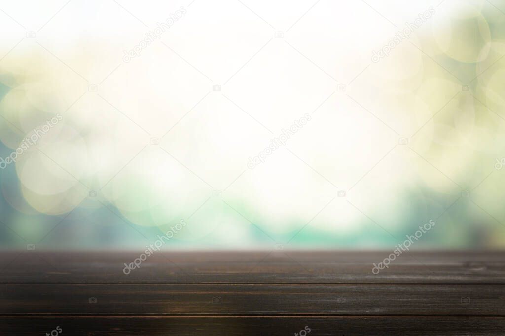 Wood table top on blur abstract green from garden in the morning background.For montage product display or design key visual layout. High quality photo