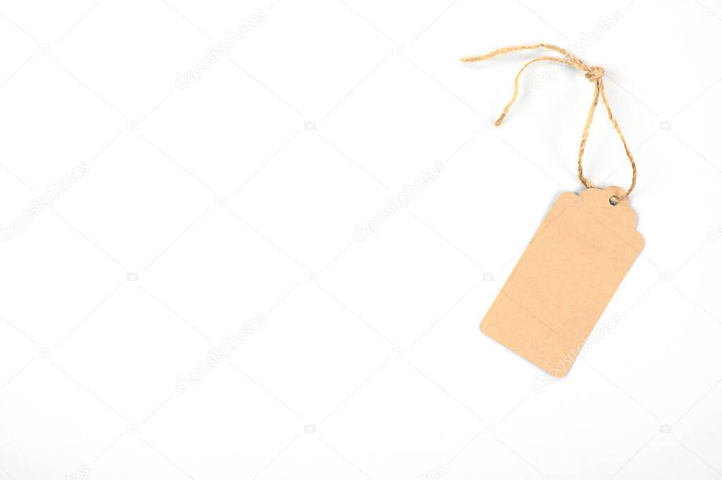 Carton tag for gift box with space for text on white background. Top view. High quality photo