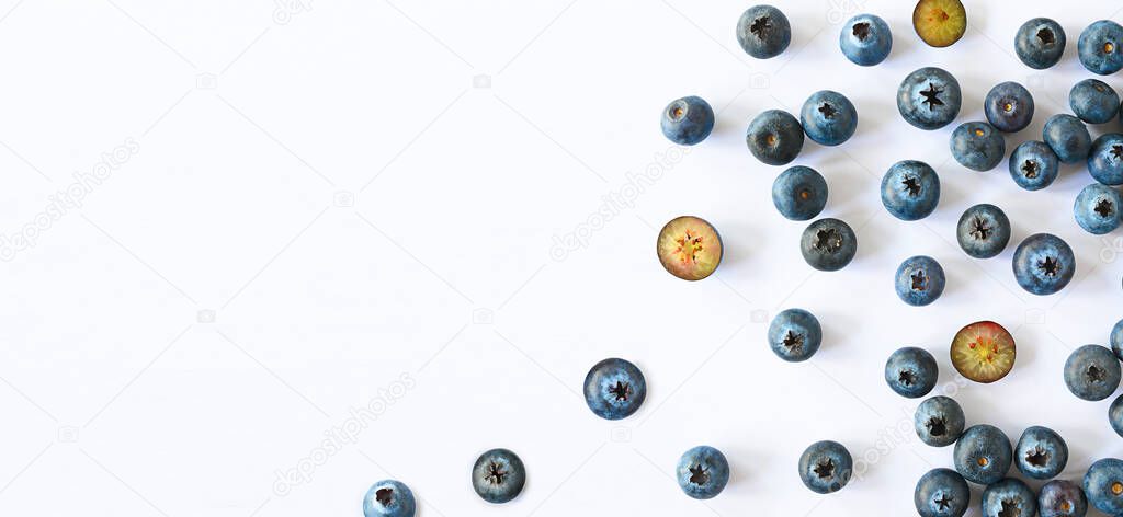 Blueberries scattered on white background banner