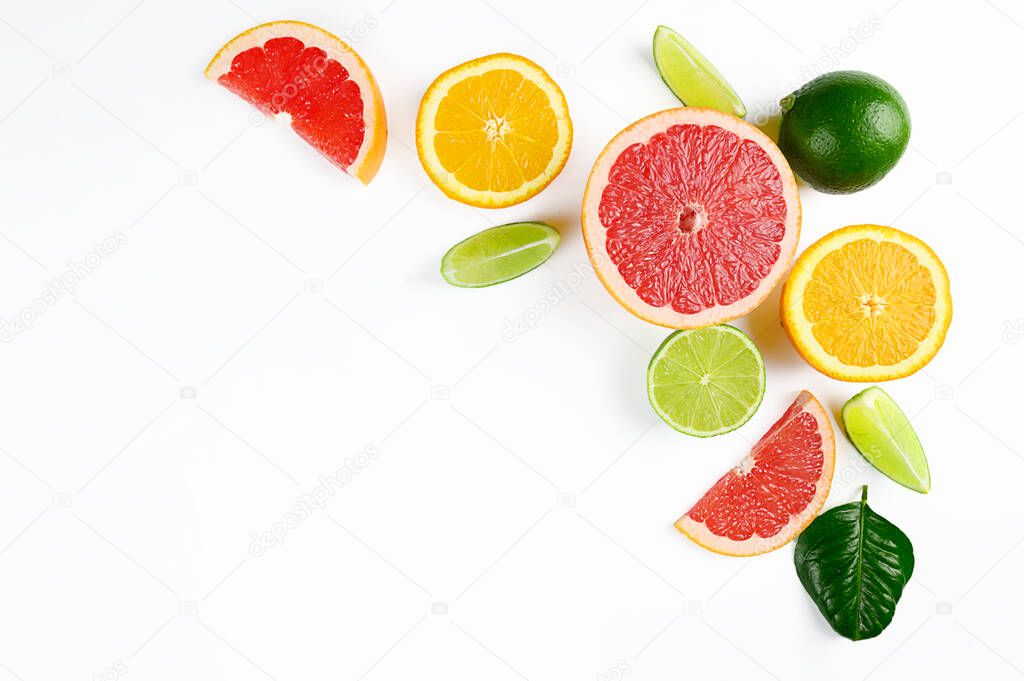 Flat lay composition with citrus fruits, leaves and flowers on white background, isolated. High quality photo