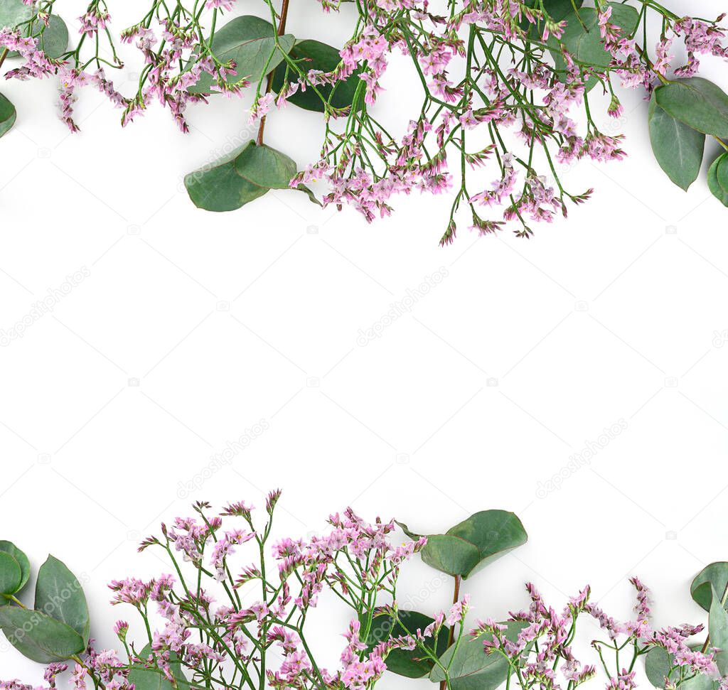 Flowers composition. Frame made of pink gypsophila flowers and eucalyptus branches on white background. Flat lay, top view, copy space