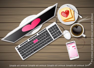 computer and mobile phone with coffee and sliced bread