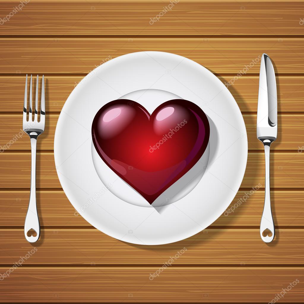 fork with knife and red heart shape on plate