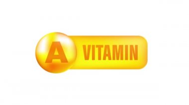 Gri arka planda gerçekçi bir düşüş gösteren A vitamini. Vitamin parçacıkları ortada. Hareket grafikleri.