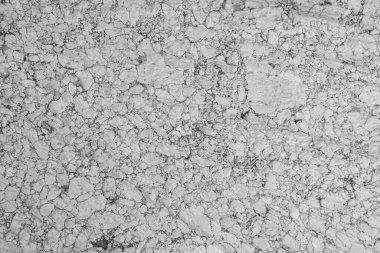 Eskimiş un değirmeni granit taşının arka planı. Beyaz, gri ve siyah granitin renkleri, yüz yıllık taş..