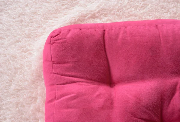 Corner of pink pillow on bed. — Stock Photo, Image