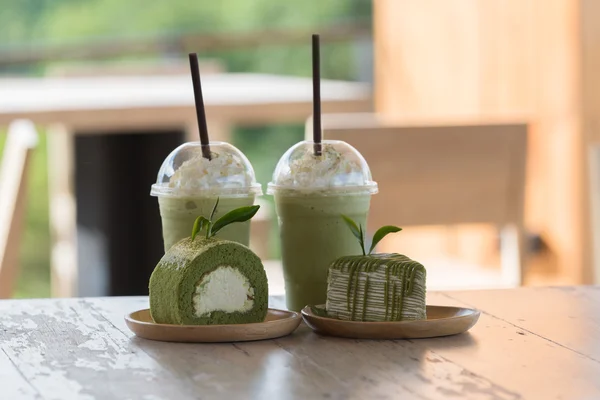 Green tea roll cake and green tea crape cake on wooden table wit — Stock Photo, Image