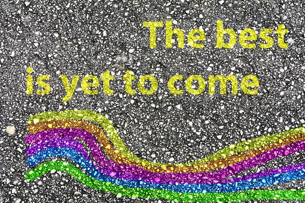 "The best is yet to come" and a rainbow painted — Stock Photo, Image
