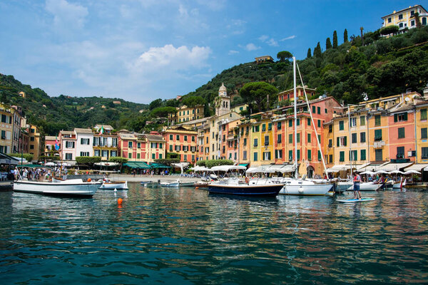 Portofino in Liguria is an Italian fishing village and holiday resort famous for its picturesque harbour and historical association with celebrity and artistic visitors.