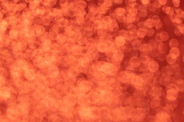 Kırmızı ton bulanık bokeh ışığı. Boşluklu odaklanmış doku arkaplanı.