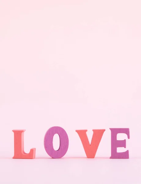 Word Love Multicolored Letters Pastel Pink Background Happy Valentine Day — Stock Photo, Image