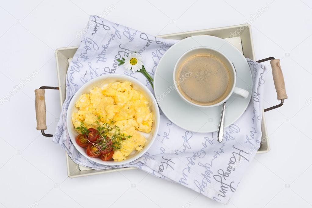 Aerial view tasty fresh scrambled eggs on plate white background