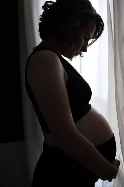 Pregnant caucasian woman touching her belly. Waiting for baby — Stock Photo, Image