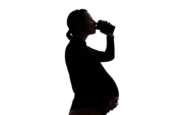 Pregnant woman with mug of coffee. Side view — Fotografia de Stock