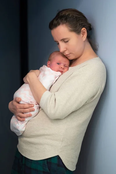 Caucasian mother holding her newborn baby girl spending time together — Stock Photo, Image