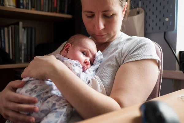 Caucasian mother holding her newborn baby girl spending time together — Stock Photo, Image