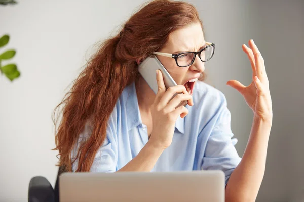 female boss shouting shouting on the cell phone