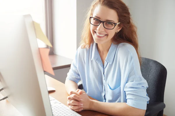 businesswoman sitting at desk